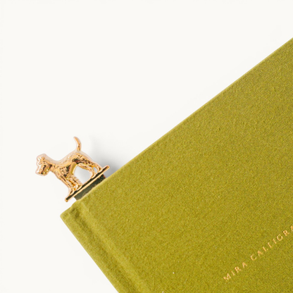 Polished metal dog-shaped bookmark and letter opener with vegan leather sleeve in foil-stamped box