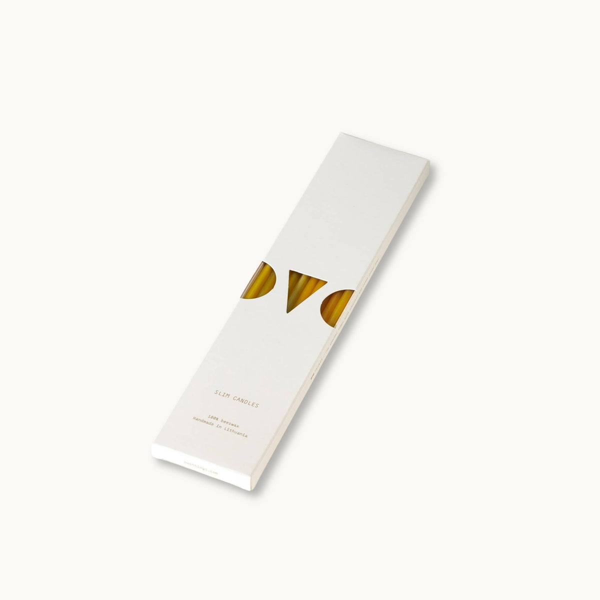 White box with slim beeswax candles on a light gray background