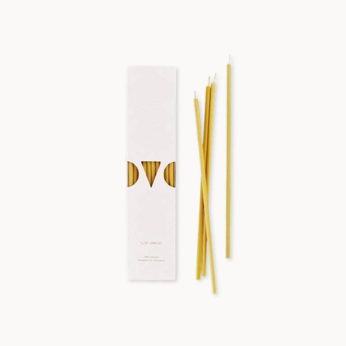 Set of slim beeswax candles with a white box featuring 'OVO' branding on a white background.