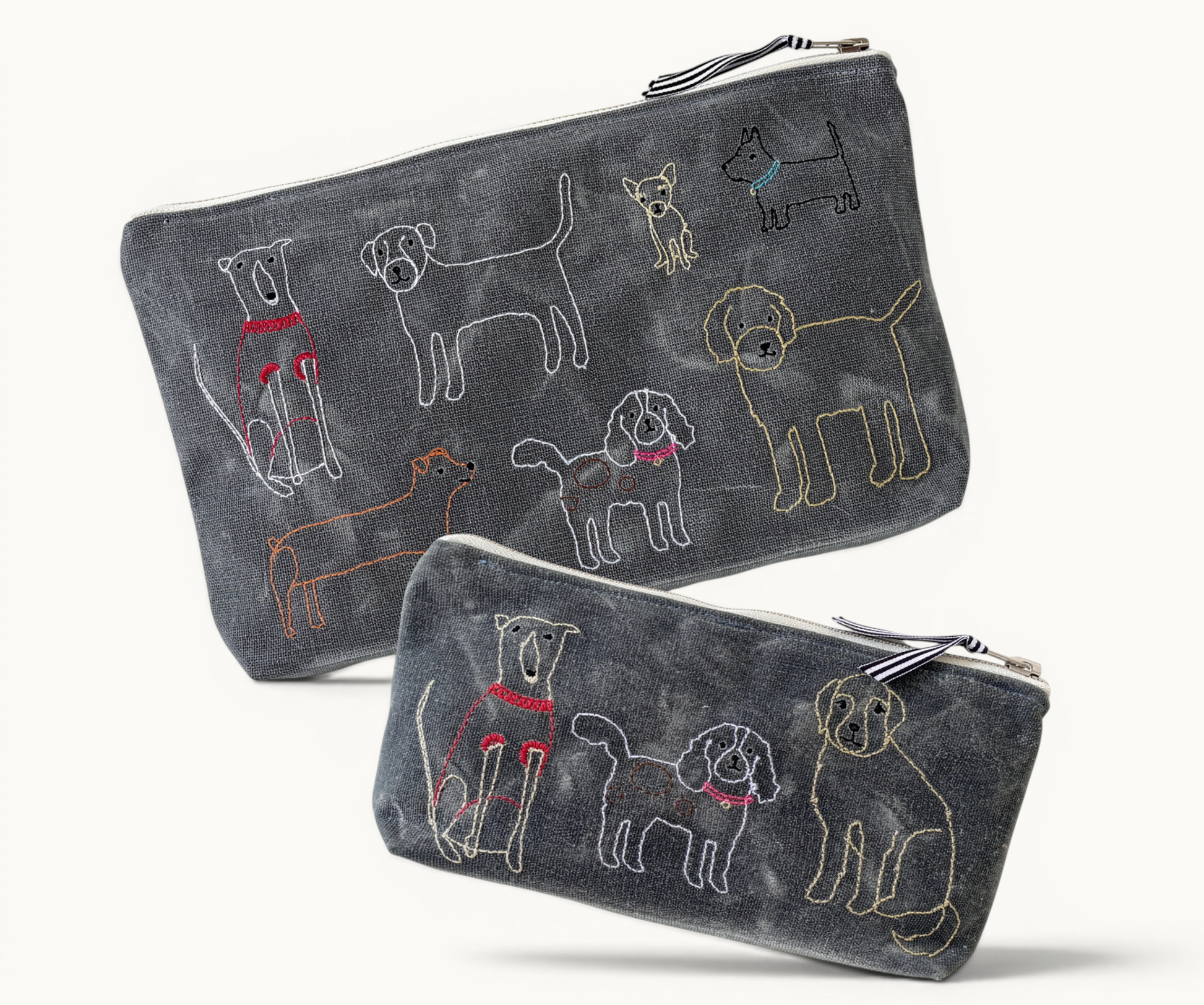 Two dark grey pouches with embroidered dog illustrations
