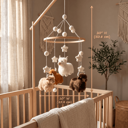 Handcrafted Highland cow felt baby mobile featuring fluffy cows in cream, caramel, and chocolate brown, with felt stars and wooden hoop, hanging above a natural wood crib in a neutral nursery.