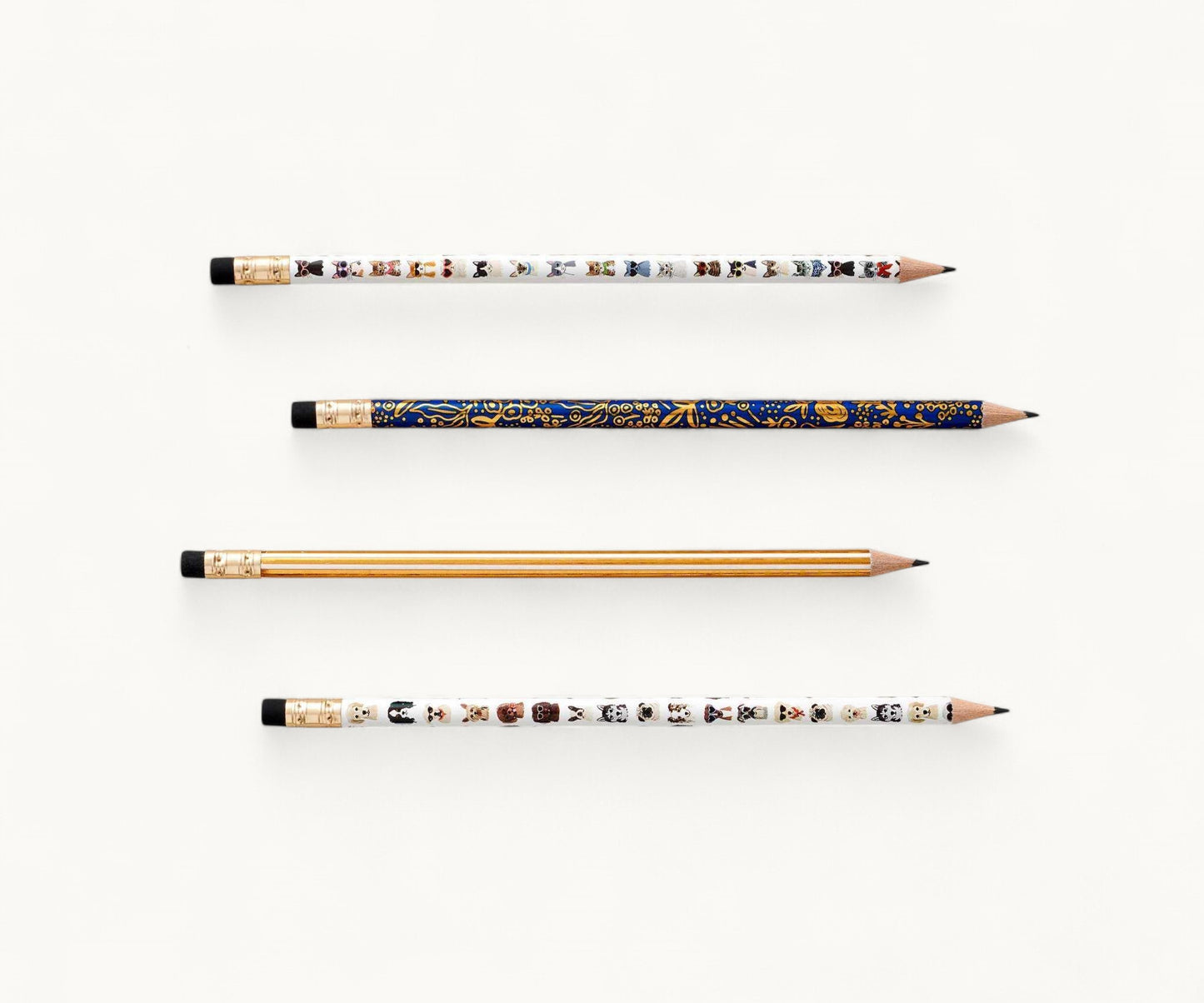 Pencil set with four intricately designed pencils on a white background