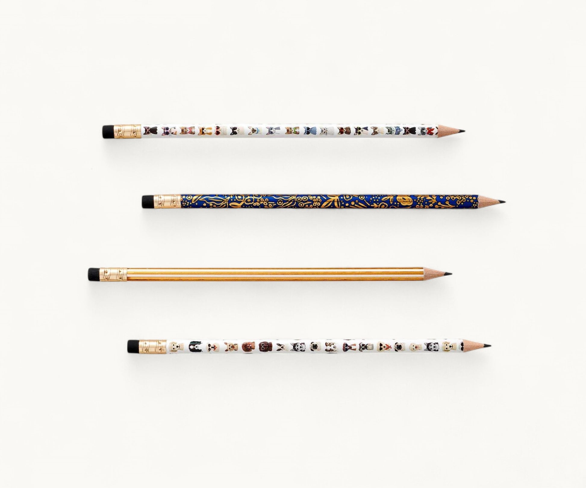 Pencil set with four intricately designed pencils on a white background