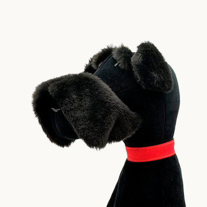 Sascha the Schnauzer from children's picture book dog+girl black dog toy with a red collar on a white background.Sascha plush. dog+girl plush. plush dog. stuffed animal.