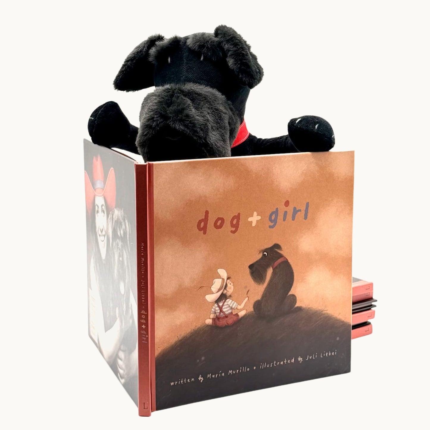Sascha the Schnauzer plush toy reading children's picture book dog+girl. Sascha plush. dog+girl plush. plush dog. stuffed animal.