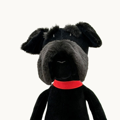 Sascha the Schnauzer from children's picture book dog+girl black plush dog toy with a red collar on a white background. Sascha plush. dog+girl plush. plush dog.stuffed animal.