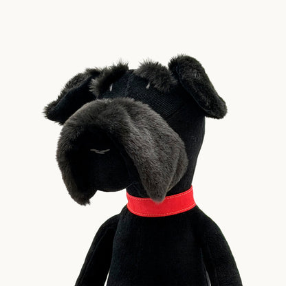 Sascha the Schnauzer from children's picture book dog+girl black plush dog toy with a red collar on a white background.Sascha plush. dog+girl plush. plush dog. stuffed animal.