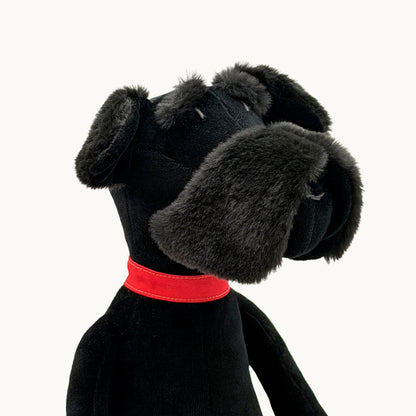 Sascha the Schnauzer from children's picture book dog+girl black plush dog toy with a red collar on a white background.Sascha plush. dog+girl plush. plush dog. stuffed animal.